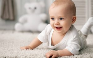 baby crawling on comfortable flooring