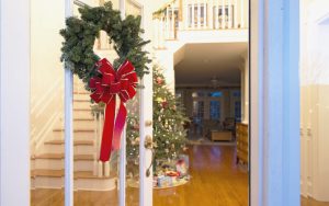 Foyer with hardwood flooring decorated for Christmas