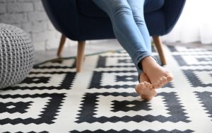 Patterned flooring paired with neutral furniture